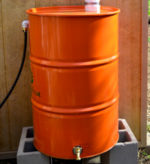 Bright orange rain barrel