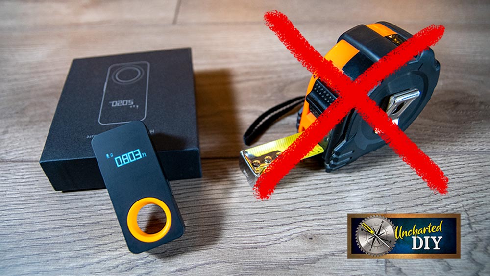 Tiny HOTO Tools Smart Laser Measure next to a tape measure